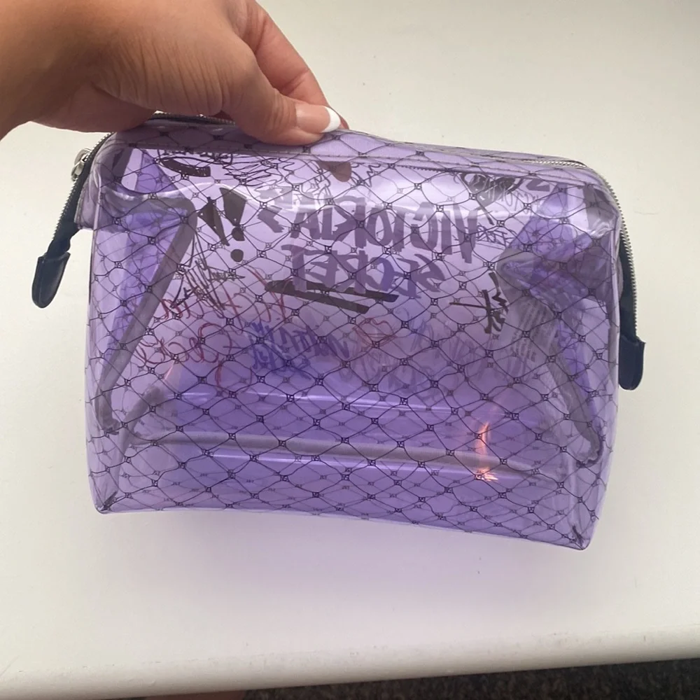 Purple plastic victorious secret makeup bag